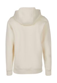 Cream-colored hooded sweatshirt with a smooth texture, long sleeves, and ribbed cuffs. Back view shows seams and a simple design.