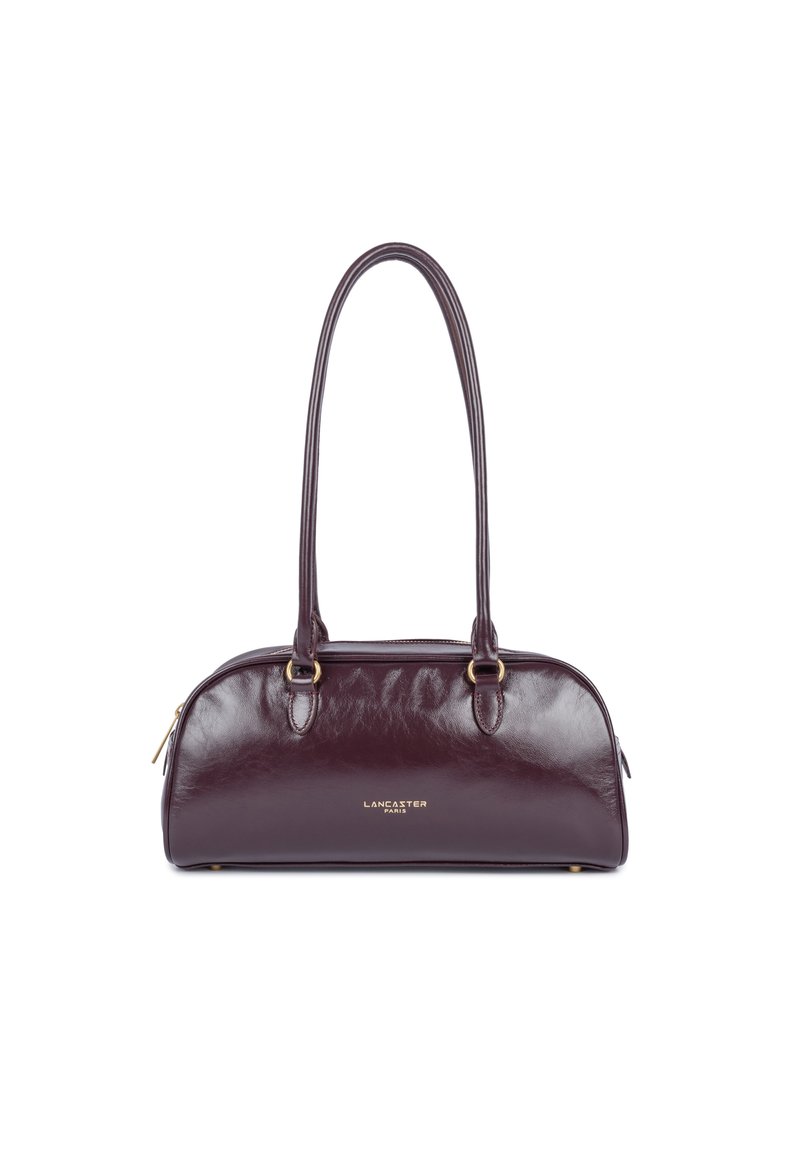 Borsa a mano in pelle borgogna con una texture liscia, forma arrotondata e doppi manici, dotata di hardware dorato e chiusura con zip.