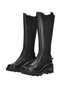 Bottes noires montantes avec un devant en cuir et un dos en tissu, dotées d'une fermeture éclair sur le côté, d'une semelle épaisse et d'une sangle décorative avec boucle.