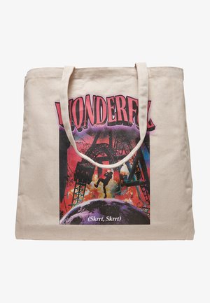 Beesin kangakott beež värviga, millel on värviline graafiline print. Esiküljel on julge roosa tekst "IMELINE" ja ringikujuline disain allosas.