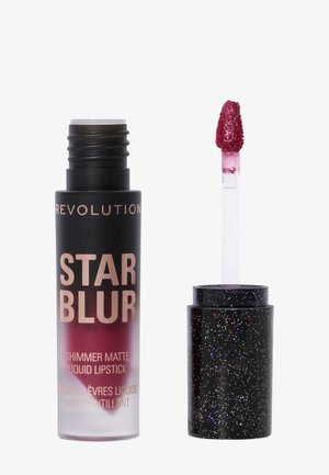 Flytende leppestift i et gradientrør fra svart til lilla med etikett "STAR BLUR"; inkluderer et glitrende svart lokk og applikator med en bustete spiss.