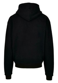 Felpa nera con una vestibilità rilassata, realizzata in materiale morbido, dotata di cappuccio, polsini a coste e una trama uniforme senza motivi o dettagli.