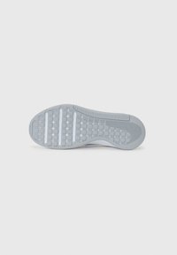 Gray rubber outsole featuring textured pattern, flex grooves, and distinct tread for traction; curved shape with a slight heel elevation.