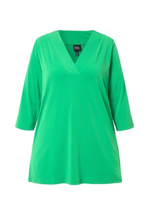 Grøn, tunika med trekvartærmer og V-udskæring. Lavet af et glat stof, har en afslappet pasform og ensfarvet design.