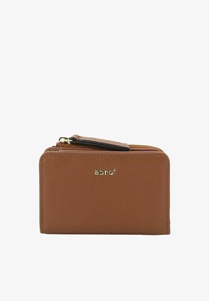 Compact brown leather wallet with gold logo, zipper closure, and a small flap on top against a white background.
