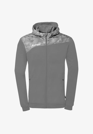 Grijze hoodie met volledige rits, geometrisch patroon op de schouders, voorzakken met ritssluiting en het "Kempa"-logo op de linker bovenborst.