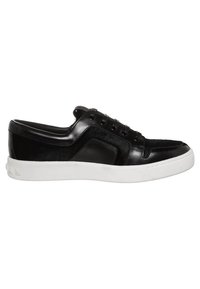 Black sneakers with a smooth leather upper and textured accent panels. Features round laces, a padded collar, and a white rubber sole.