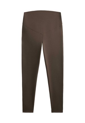 Braune Leggings mit hohem Bund, aus glattem, elastischem Material. Verfügt über zwei Seitentaschen und eine enganliegende Silhouette.