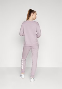 adidas Sportswear - ESSENTIALS LINEAR CUFFED PANT - Træningsbukser - preloved fig Miniaturebillede 1