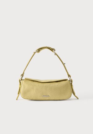 Yellow textured shoulder bag with a curved top flap and adjustable strap against a plain white background.