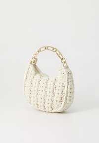 White crochet handbag with a rounded shape, zipper closure, and a gold chain handle. Features textured yarn with raised stitch patterns.