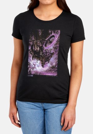 Woman wearing black t-shirt with purple and black graphic of a motorcyclist riding through a swirling, smoky vortex.