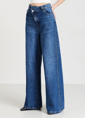 Wide-leg blue denim jeans with a high waist, featuring a front button closure, pockets, and a faded wash for a textured appearance.