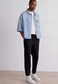 Calvin Klein Jeans TECHNICAL BADGE PANT - Joggebukse - black