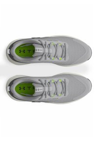 Gray athletic shoes with a mesh upper, green accents, round toe, and a lace-up design. Features branding on the tongue and insole.