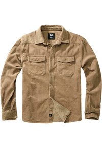 Camicia in corduroy color sabbia con maniche lunghe, chiusura a bottoni, due tasche sul petto e una sottile texture a coste. Presenta un'etichetta del marchio sul fondo.