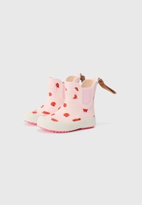 Bottes de cheville en caoutchouc rose avec motifs de coccinelles, semelles blanches et semelles texturées roses. Comprend des panneaux élastiques sur les côtés et une languette.