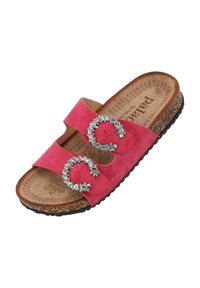 Pink suede slide sandal with two decorative buckle accents, cork footbed, and a textured black rubber sole.