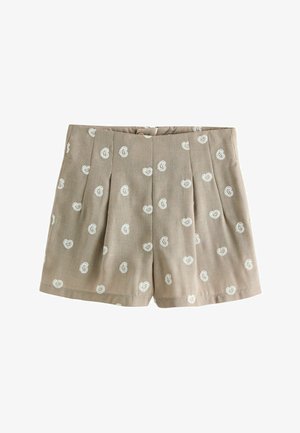 Short beige avec imprimé cachemire blanc, plis devant et taille, posé à plat sur un fond blanc.