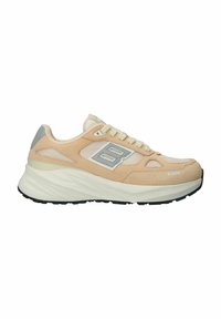 Light beige athletic sneaker with suede and mesh materials, featuring a thick white midsole and black rubber outsole. Silver accent logo design.