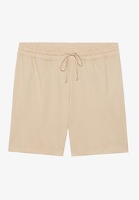 Beige pamut rövidnadrág, kényelmes, rugalmas derékkal, zsinóros díszítéssel és egyenes vonalakkal. Simaság jellemzi, és nincsenek látható minták vagy díszítések.