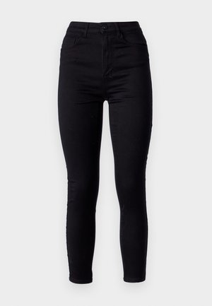 Jean skinny noir taille haute, fabriqué en denim extensible. Il dispose d'une fermeture à bouton sur le devant et de deux poches arrière. Texture lisse.