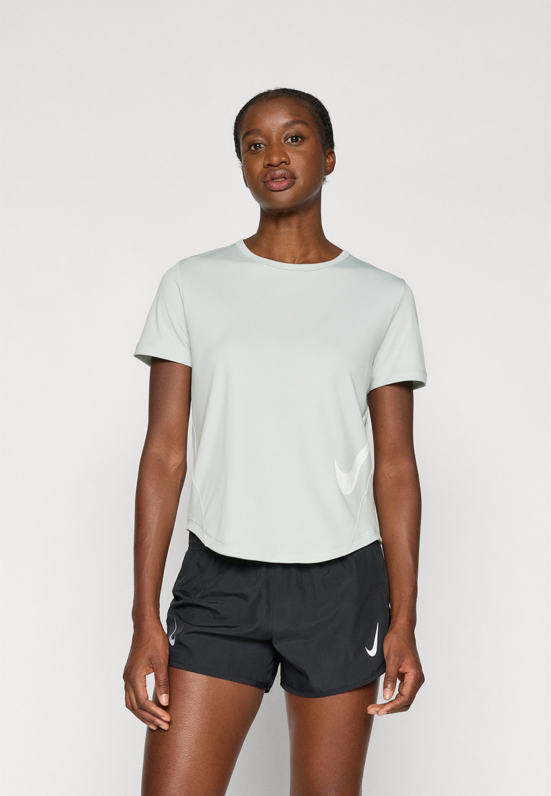 silver and white nike shirt