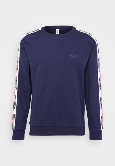 Marineblå bomullssweatshirt med lange ermer, rund hals og "MOSCHINO"-logo på hvite side-striped. Glatt tekstur og standard passform.