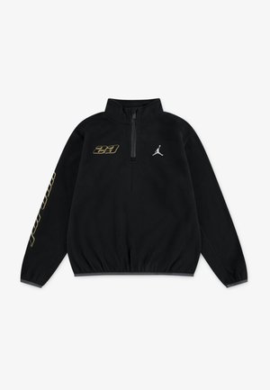 Pullover nero in pile con zip a quarto e orlo elasticizzato. Presenta il logo dorato "23" e l'emblema bianco di Jordan sul petto e sulla manica.