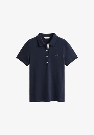 Polo bleu marine à manches courtes avec col, quatre boutons blancs et petit logo blanc GANT sur le côté gauche de la poitrine.