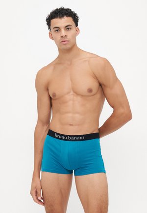 Blaue Boxershorts mit einem schwarzen elastischen Bund, auf dem der Markenname "bruno banani" aufgedruckt ist. Der Stoff wirkt weich und glatt.