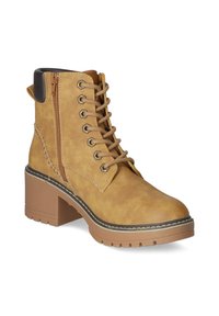 Tan ankle boot with a textured faux leather upper, lace-up front, side zipper, block heel, and contrasting outsole stitching.