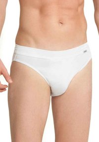 Vita korta underkläder i mjukt, stretchigt material med en bred midjeband. Har en minimalistisch design och en subtil logotag på framsidan.