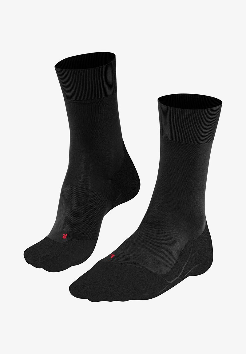 Calzini neri con parte superiore a coste, corpo liscio e punte rinforzate. Presentano un piccolo logo rosso sul lato, progettati per comfort e durata.