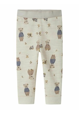 Krämfarbene Babyleggings mit einem Druck von Teddybären und Spielzeugzügen, die Bären in blauen Jacken und braunen Hosen zeigen.
