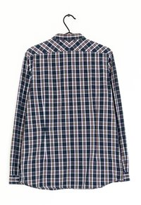 Pitkähihainen ruutupaita, jossa on sininen, valkoinen ja violetti värimaailma. Valmistettu tekstuuripinnasta. Roikkuu mustassa koukussa.