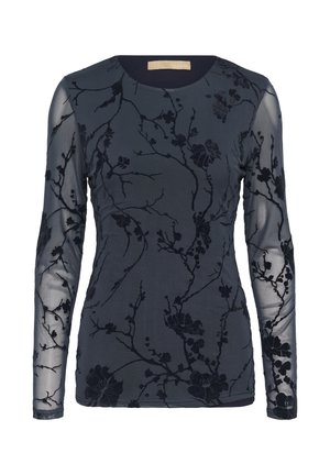 Long-sleeve top in dark navy with sheer textured sleeves and intricate black floral embroidery throughout. Round neckline, soft fabric.