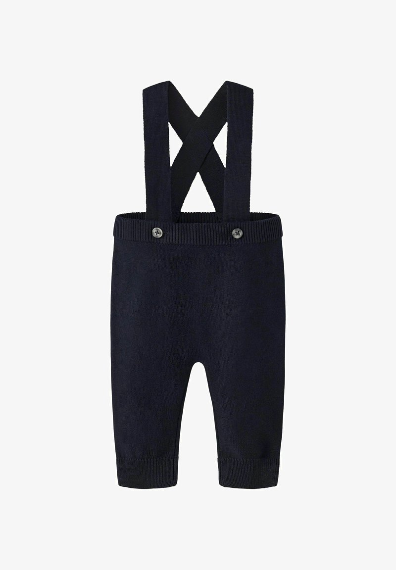 Salopette in maglia blu navy con bretelle incrociate, polsini a coste e dettagli con bottoni in vita. Tessuto morbido, design aderente, gambe lunghe.