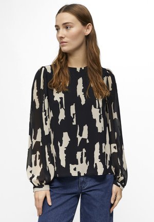 Blusa de manga larga en azul marino con un patrón abstracto en crema, que presenta mangas abullonadas y un dobladillo recto, fabricada en una tela ligera.