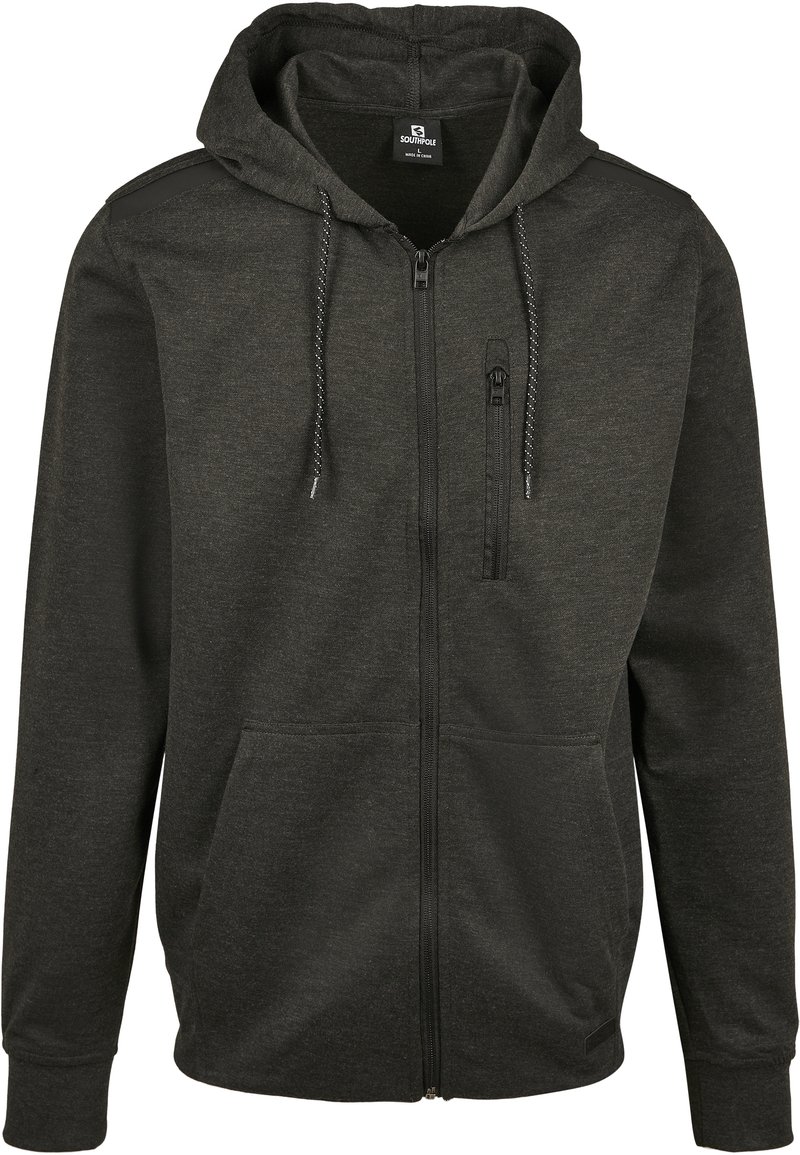 Hoodie nero con zip realizzato in un tessuto morbido, dotato di tasca a marsupio, cappuccio con coulisse e piccola tasca sul petto dettagliata con zip.
