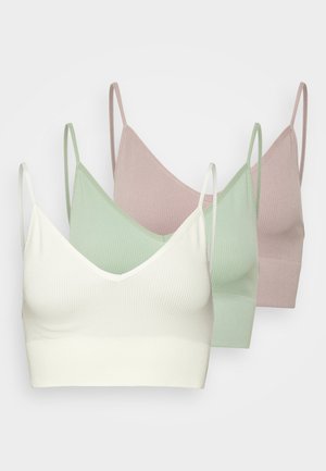 Tre reggiseni a canottiera in tessuto a coste. Colori: avorio, verde menta e rosa chiaro. Caratterizzati da scollature a V e spalline sottili e regolabili.