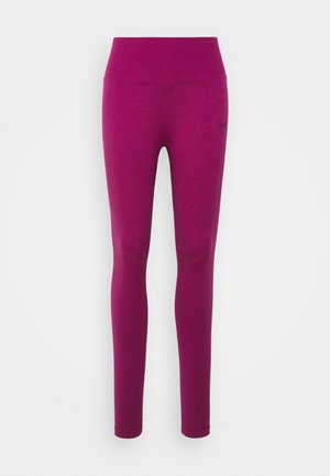 Tettside leggins i en livlig magenta nyanse, laget av et glatt, elastisk stoff. Har en høy midje og sømløs design.