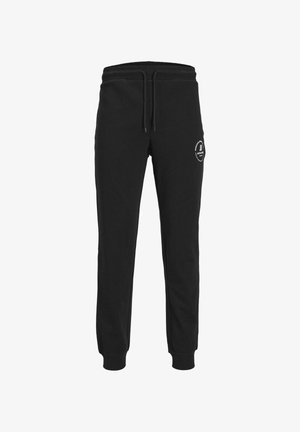 Pantaloni de trening negri, dintr-un amestec moale de bumbac, cu talie elastică și șnur de ajustare, precum și manșete ribbate. Logo imprimat pe picior.