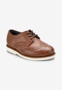 Brown leather lace-up shoe with perforated detailing, rounded toe, and white rubber sole. Features dark gray laces and smooth texture.