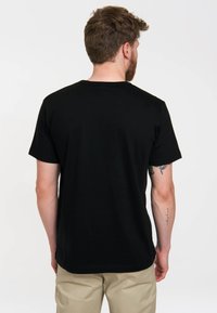 Black short-sleeve t-shirt with a crew neck, made of smooth cotton, featuring a plain design, displayed from the back.
