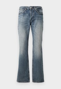 Jean bleu évasé avec des détails décolorés, cinq poches, passants de ceinture et accessoires en métal argenté. Confectionné en denim avec une texture douce.