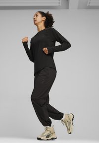 Puma SEASONS - Ilgarankovis viršutinės dalies drabužis - black