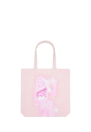 Sac cabas rose clair avec une illustration lumineuse d'une femme en crop top et short, entourée d'étincelles.