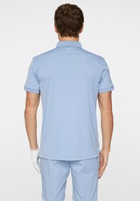 J.LINDEBERG Sports TOUR - Pikeepaita - rain washed