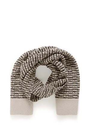 Kootud sall, millel on kreemi- ja pruunikirjaline muster, ribitud otstega, mis on ühtlase kreemivärviga. Pehme tekstuur, ringikujuline kuju.